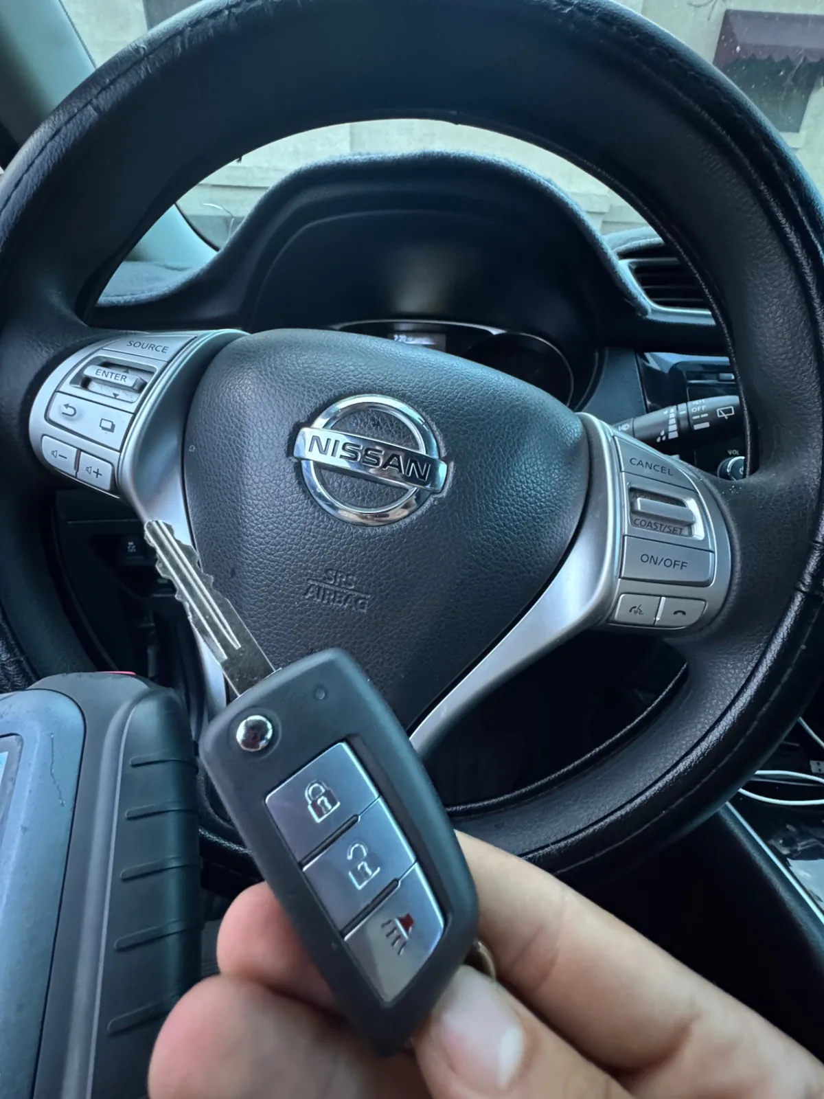 Mobile smart key replacement job performed inside a vehicle during a real locksmith visit