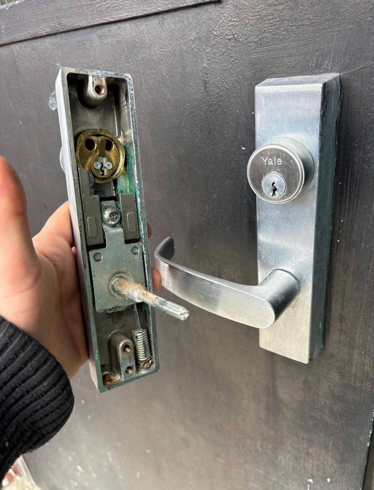 Yale lever and lock hardware being replaced during a real residential lock change service